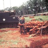 "Tom Watkins Placing Sand Bag on ABtry 6/27th Arty FDC Bunker - In the Field - March 68"